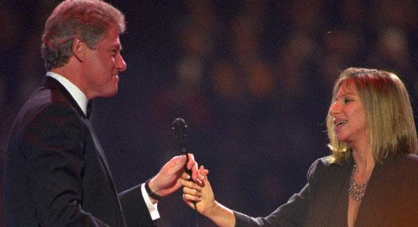 Streisand singing to Bill Clinton in 1993. AP.